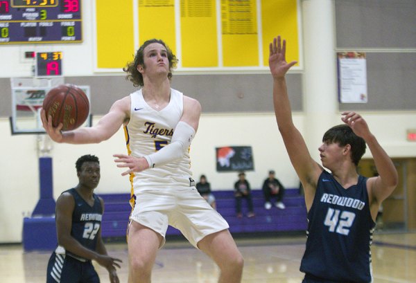 Lemoore's Will Schalde led his team in scoring Friday night with 14 points in the Tigers ' loss to visiting Redwood High School. 